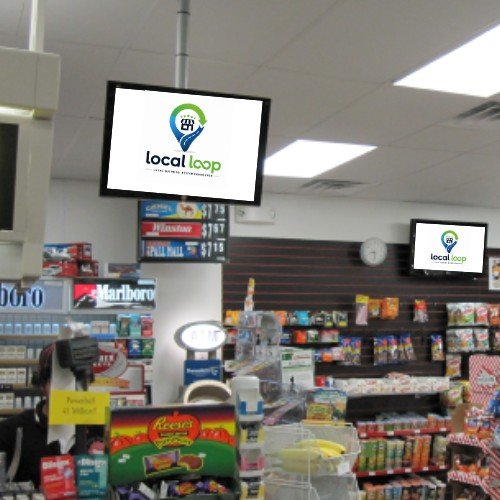 Local Loop ad screen mounted above a store checkout counter